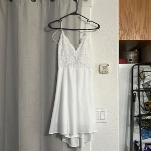 White mini dress with lace on top.